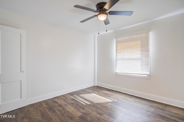 unfurnished room with baseboards, wood-type flooring, and a ceiling fan