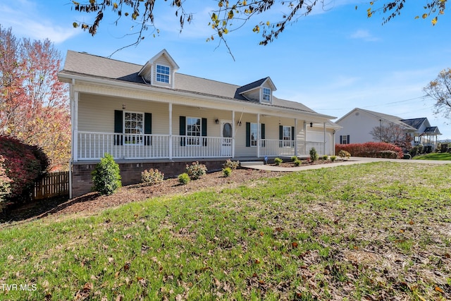 view of front of property with a porch and a front lawn