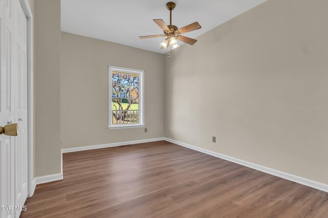 empty room with wood-type flooring and ceiling fan