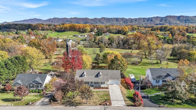 birds eye view of property featuring a mountain view