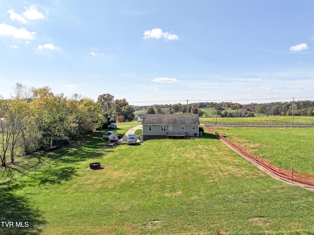 birds eye view of property with a rural view