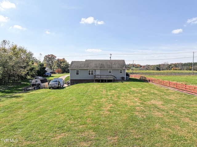 exterior space featuring a rural view and a deck