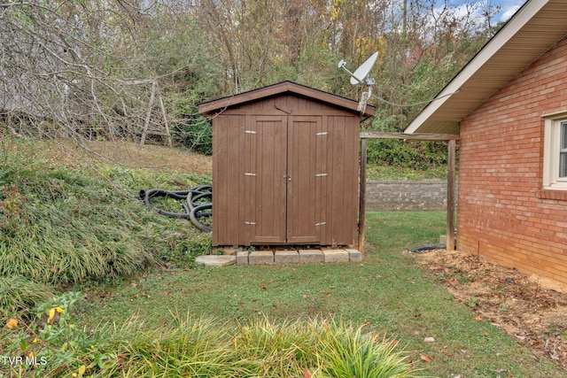 view of outdoor structure with a lawn