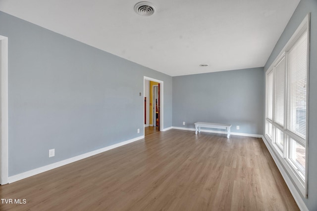 spare room featuring light hardwood / wood-style flooring