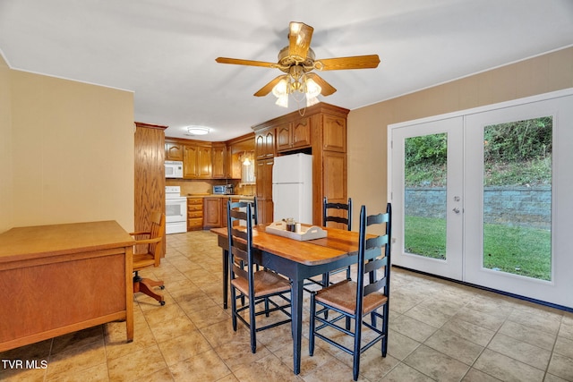 dining space with french doors, ceiling fan, and light tile patterned floors