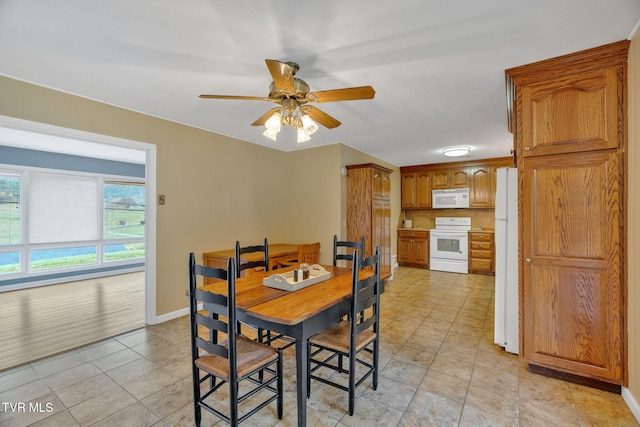 dining room with ceiling fan