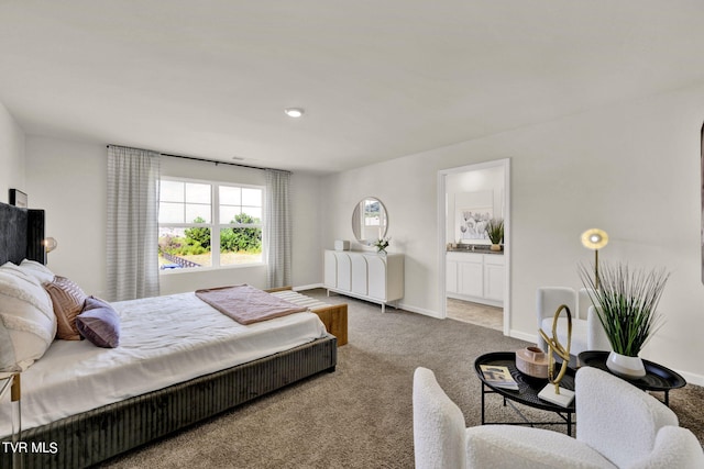 carpeted bedroom with ensuite bathroom