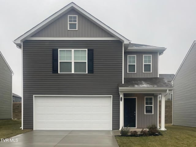 view of front of house with a front lawn and a garage