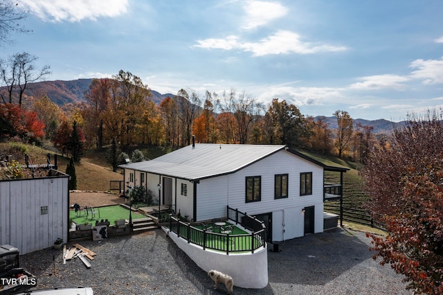 back of property featuring a mountain view