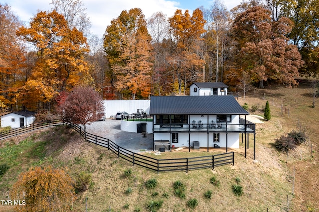 rear view of property with a wooden deck