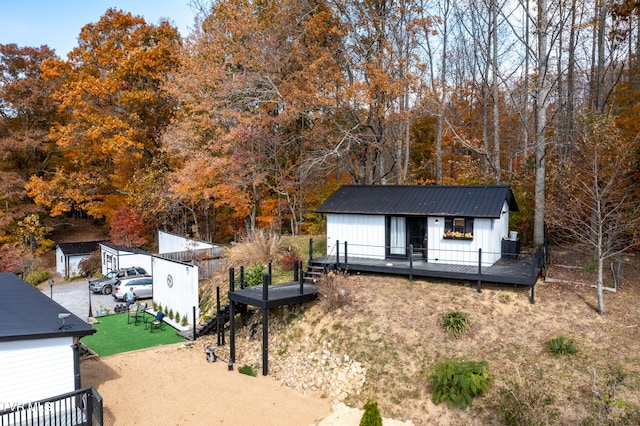 exterior space with an outdoor structure and a wooden deck