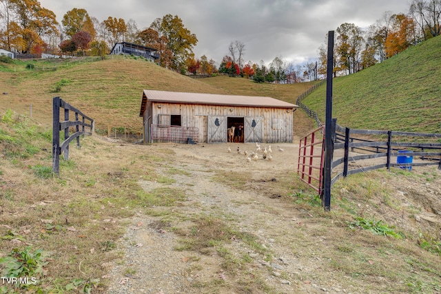 view of outbuilding with a rural view