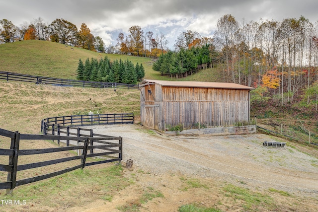 view of outbuilding with a rural view