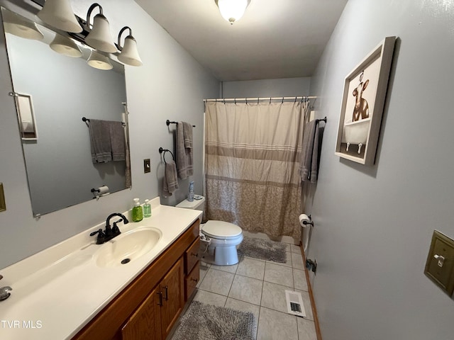 bathroom featuring toilet, curtained shower, vanity, and tile patterned flooring