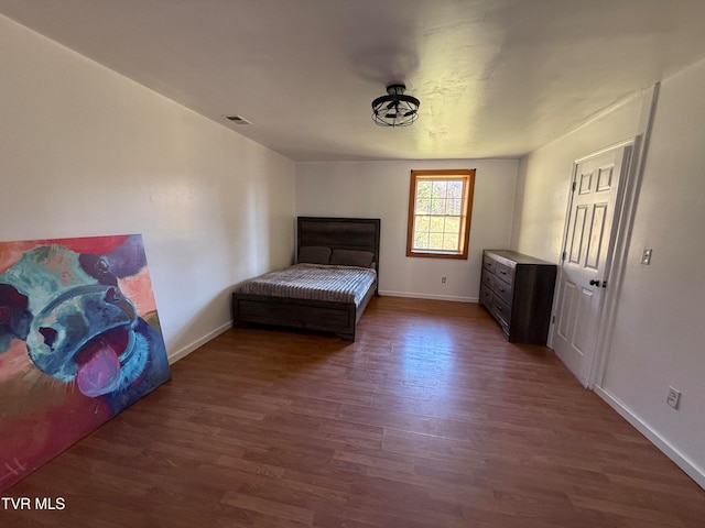 unfurnished bedroom featuring dark hardwood / wood-style floors