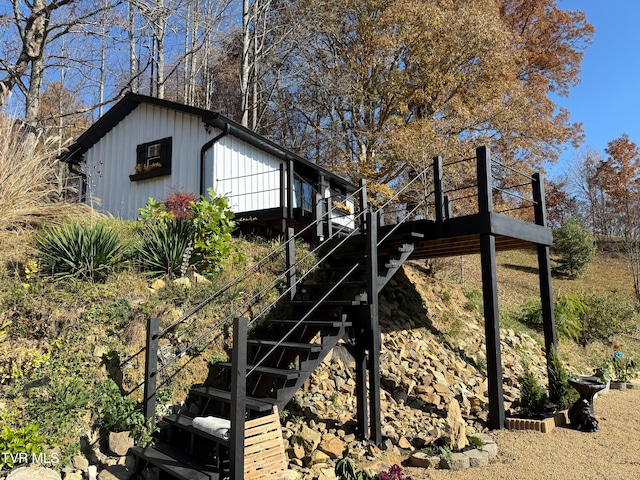 view of property exterior with a wooden deck