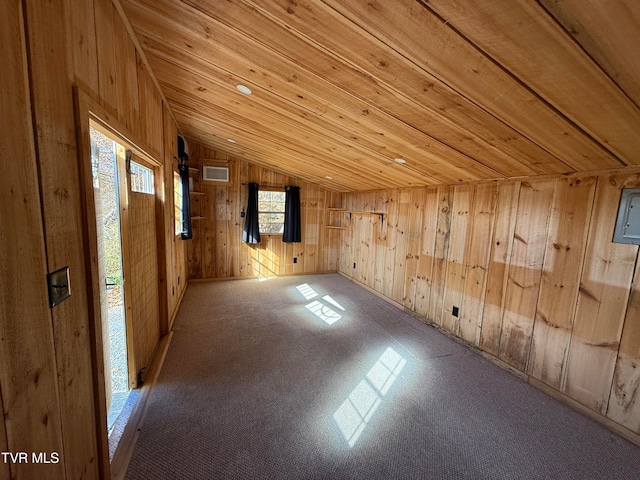 additional living space with light colored carpet, wooden walls, wooden ceiling, and vaulted ceiling