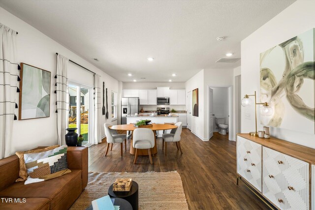 dining area with dark wood-type flooring