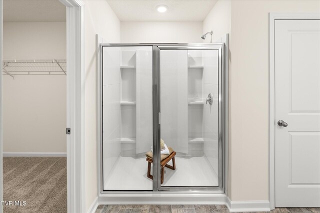 bathroom with an enclosed shower