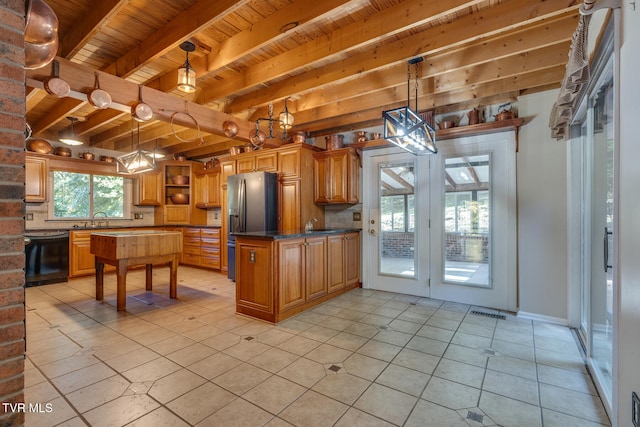 kitchen with black dishwasher, sink, backsplash, pendant lighting, and beam ceiling