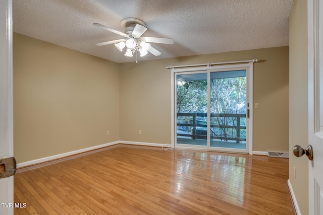 unfurnished room with light hardwood / wood-style flooring, a textured ceiling, and ceiling fan