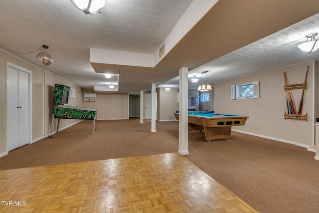 playroom with light parquet flooring, a textured ceiling, billiards, and wooden walls