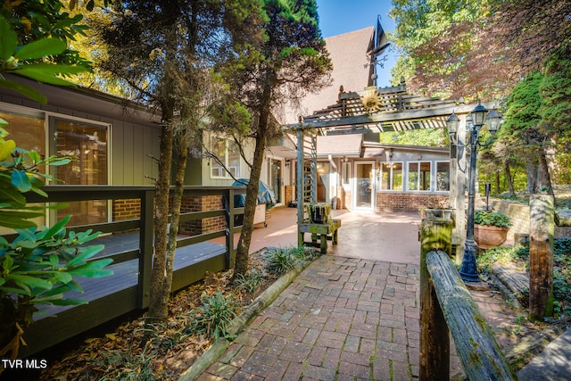 surrounding community featuring a patio area and a pergola