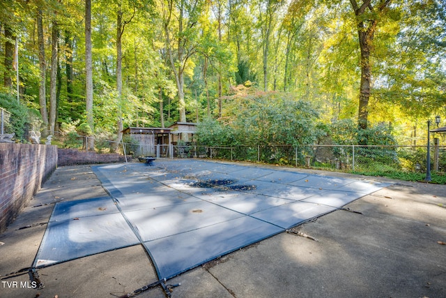 view of swimming pool with a patio