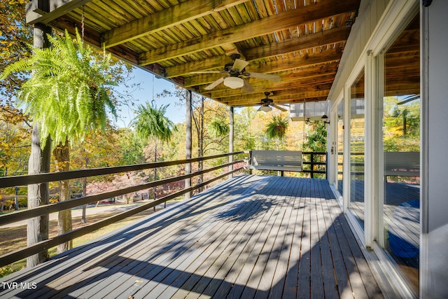 wooden terrace featuring ceiling fan