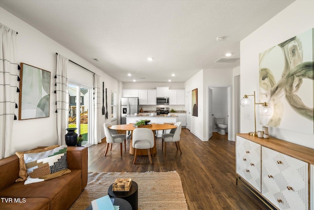 dining area featuring dark hardwood / wood-style floors