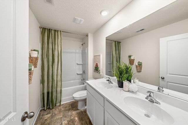 full bathroom with vanity, toilet, shower / bath combination with curtain, and a textured ceiling