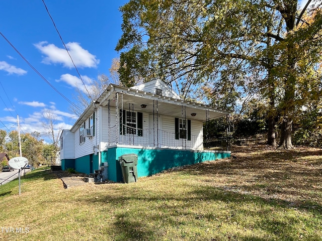 view of front of house with a front yard and a porch