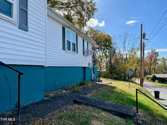 view of property exterior featuring a yard