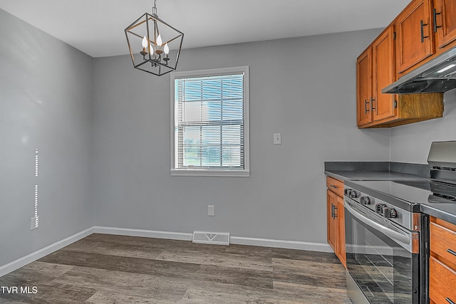 kitchen with dark wood-type flooring, hanging light fixtures, ventilation hood, a notable chandelier, and stainless steel electric range oven