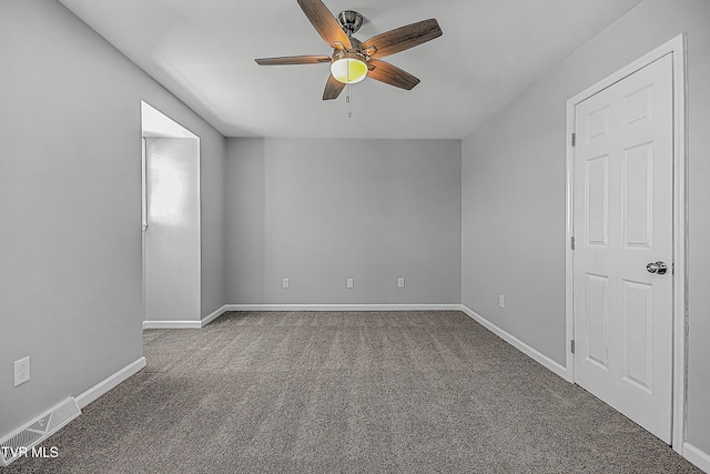 unfurnished room with ceiling fan and carpet flooring