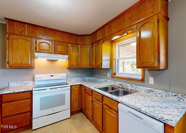 kitchen featuring white appliances and sink