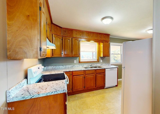 kitchen featuring white appliances and sink