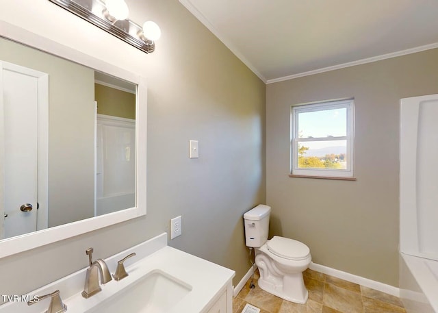 bathroom with vanity, toilet, and crown molding