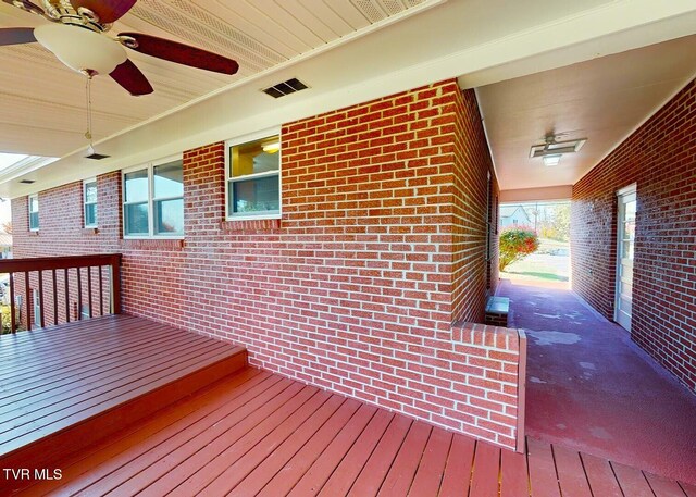 wooden terrace with ceiling fan