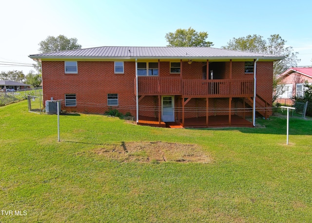 back of house featuring a yard, cooling unit, and a wooden deck