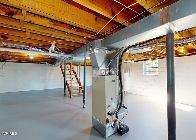 basement featuring heating unit and gas water heater