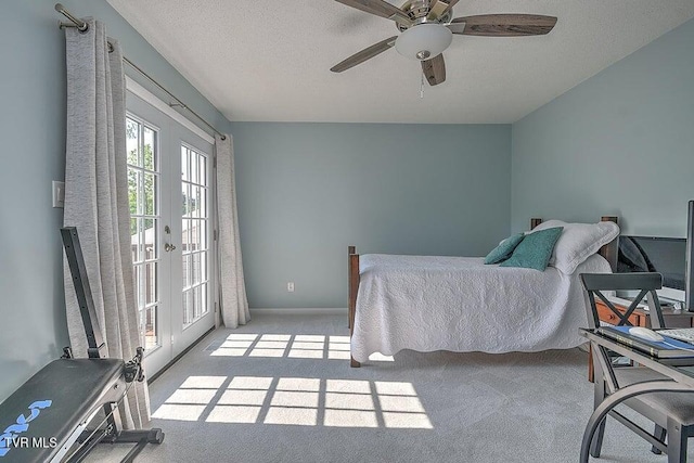 bedroom featuring carpet floors, baseboards, access to outside, french doors, and a ceiling fan