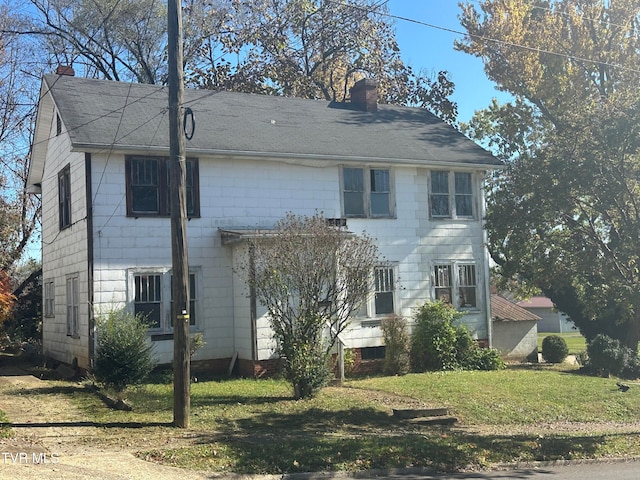 view of property exterior with a lawn