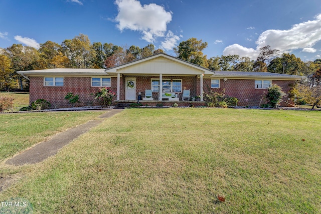 single story home featuring a porch and a front yard