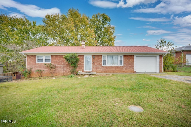 single story home featuring a front lawn and a garage