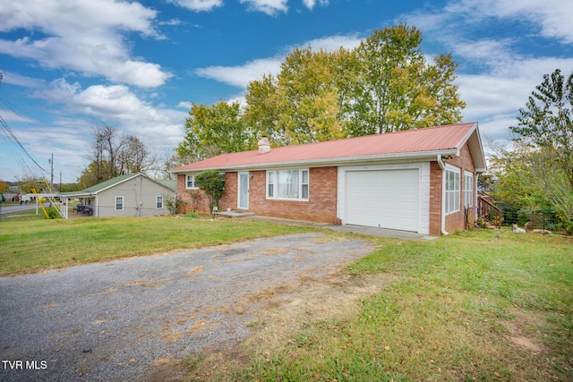 ranch-style house with a garage and a front lawn