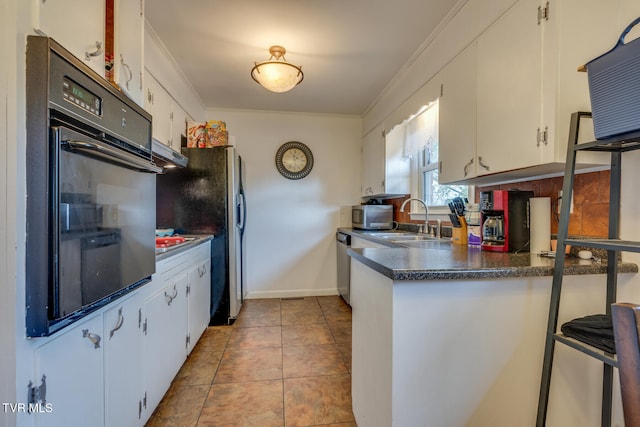 kitchen featuring stainless steel appliances, sink, light tile patterned floors, ornamental molding, and white cabinetry