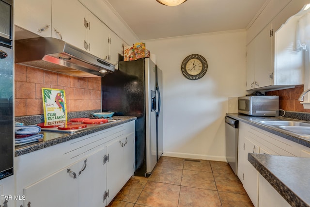 kitchen featuring white cabinets, sink, backsplash, and appliances with stainless steel finishes