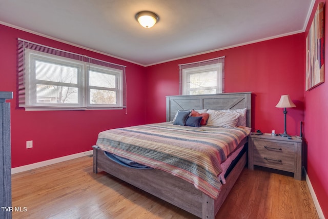 bedroom featuring ornamental molding and hardwood / wood-style flooring