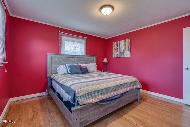 bedroom featuring wood-type flooring and crown molding